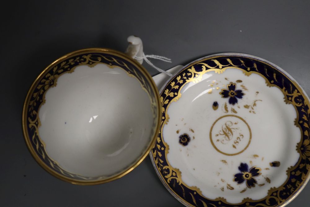 A pair of Miles Mason blue and gilt teacups and saucer, a documentary London handle cup and saucer pattern 2/1486 dated 1825